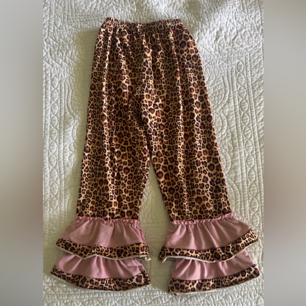 Leopard print pants with pink ruffles. Toddler size 4T-5T